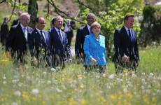 G7 leaders, led by German PM Angela Merkel (in blue) vowed this week to achieve aggressive cuts to global carbon emissions, although their plan was a bit lacking on details. [Image Source: EPA]