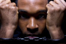 31088896 - close up portrait of hand cuffed black man