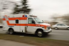 6620467 - a motion blur of an ambulance driving down a street.