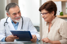 37885304 - doctor talking to his female patient at office