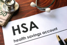 60527092 - paper with words weekly health savings account (hsa) on a table.