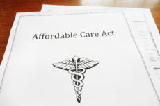 34499882 - affordable care act / obamacare document on a desk
