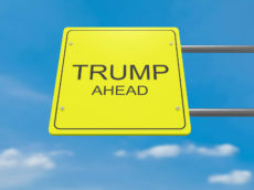 66047268 - yellow road sign trump ahead against a cloudy sky, 3d illustration