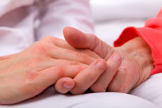 36914302 - caregiver holding elderly patients hand at home